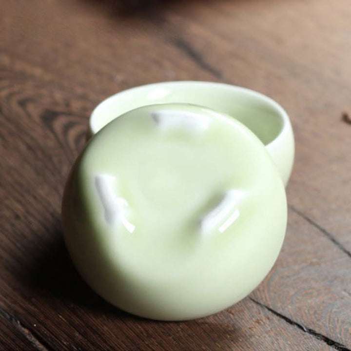 Taza de té de cerámica con forma de pez koi de colores y Buddha Stones