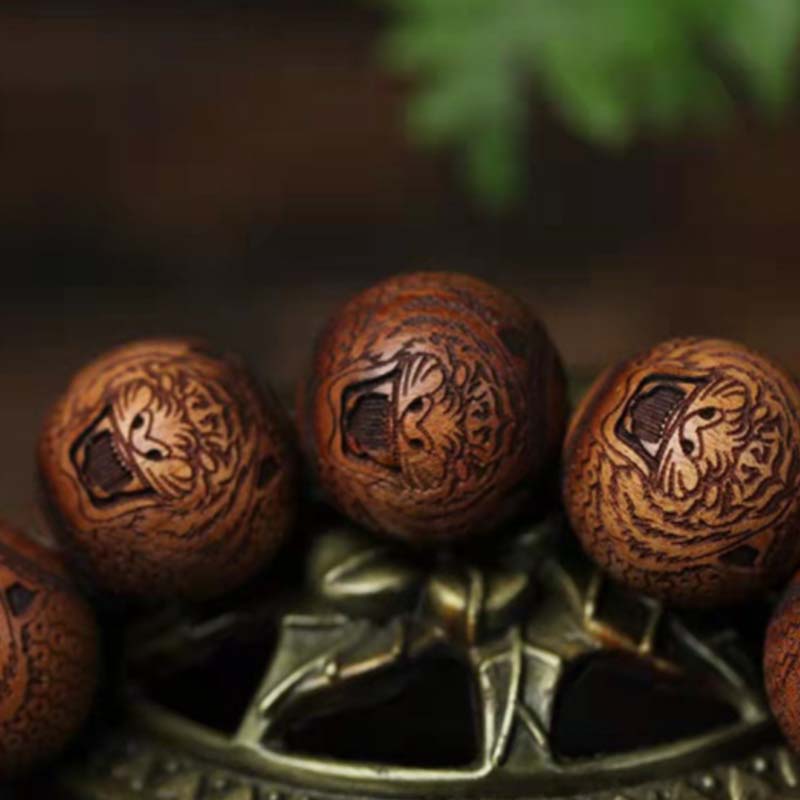 Pulsera de protección de tigre con grabado de palisandro tibetano con Buddha Stones