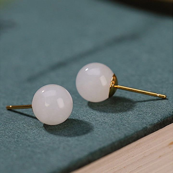 Pendientes de tuerca con bendición de jade blanco redondo de plata de ley 925 con Buddha Stones
