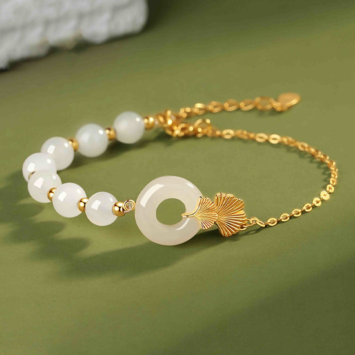 Pulsera de la suerte de hoja de ginkgo con hebilla de paz de jade blanco hetiano de plata de ley 925 con Buddha Stones