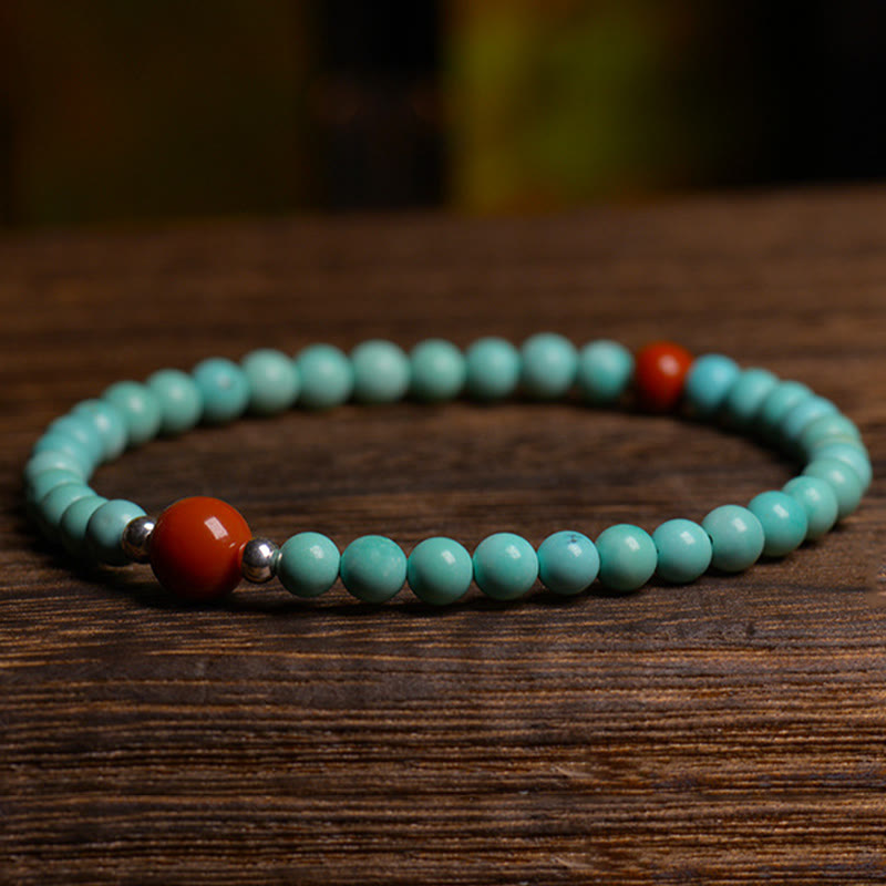 Pulsera de protección de cuentas de ágata roja turquesa de Buddha Stones - image 4