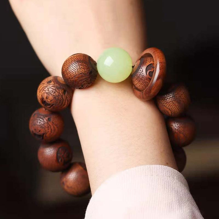 Pulsera de protección de tigre con grabado de palisandro tibetano con Buddha Stones