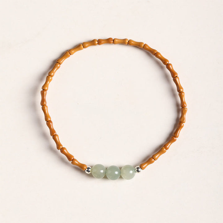 Pulsera de la suerte con cuentas de jade hetiano con patrón de bambú de oliva natural con Buddha Stones