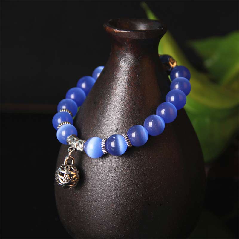 Pulsera de la suerte con ojo de gato tibetano y Buddha Stones