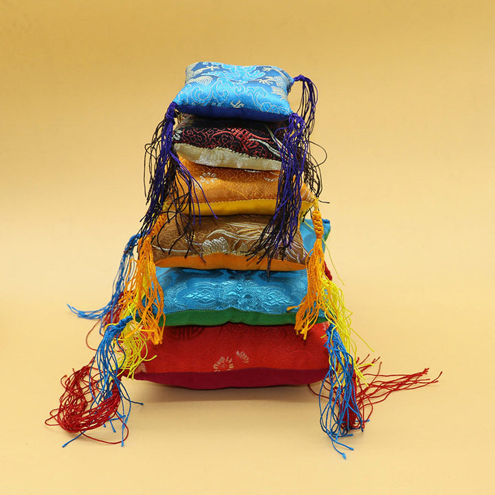 Decoración de cojín de cuenco tibetano con decoración de borlas