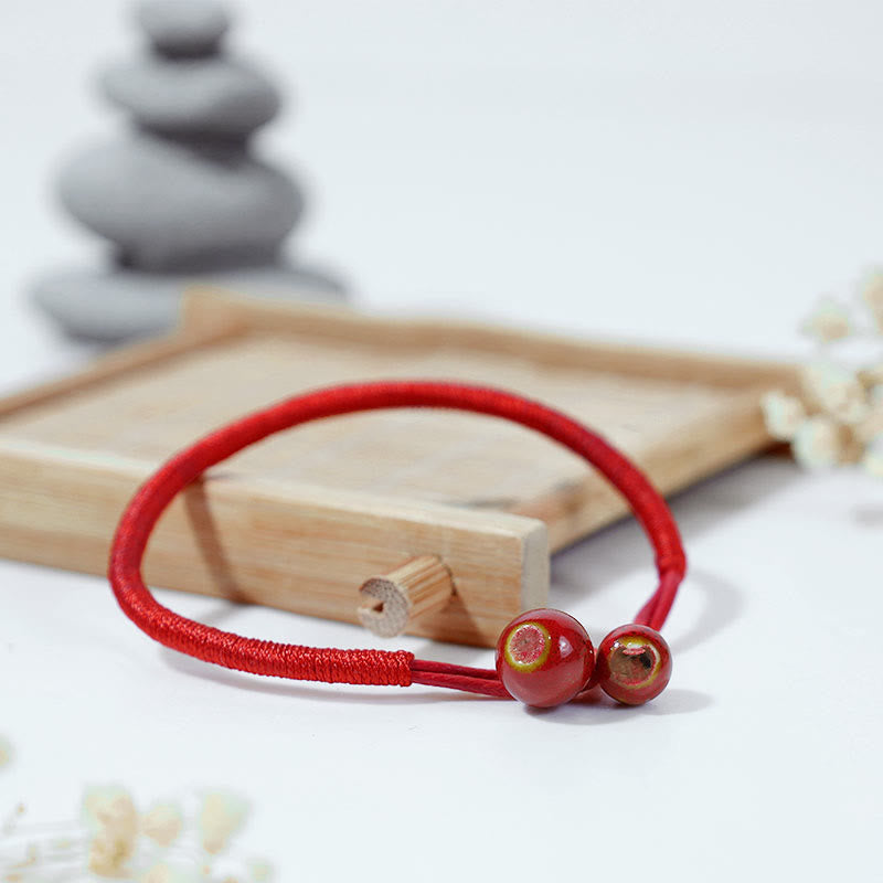 Pulsera de cerámica con hilo rojo de la suerte FengShui de Buddha Stones