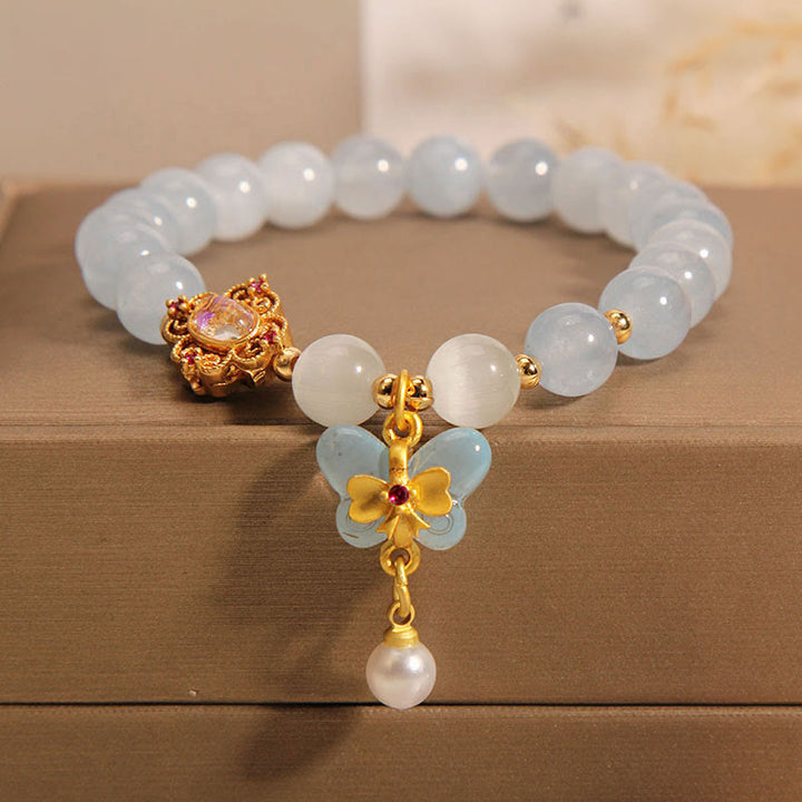Pulsera con dije de perlas y mariposas curativas con ojo de gato, aguamarina y Buddha Stones
