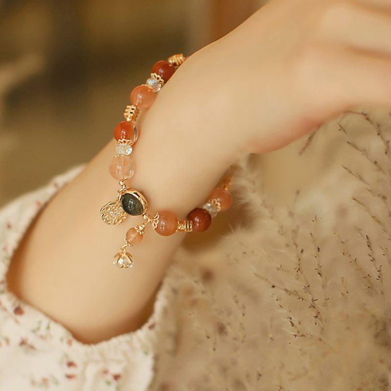 Pulsera de riqueza de flores de estrella de ocho puntas de cuarzo rutilado multicolor natural con Buddha Stones