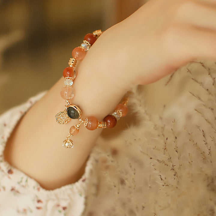 Pulsera de riqueza de flores de estrella de ocho puntas de cuarzo rutilado multicolor natural con Buddha Stones