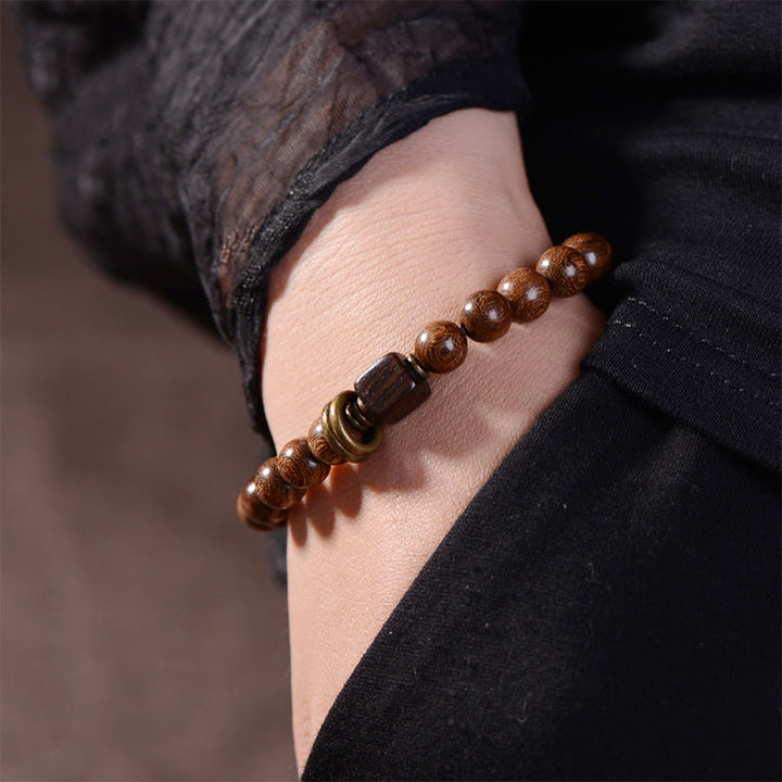 Pulsera de espiritualidad de madera de Phoebe Zhennan con Buddha Stones