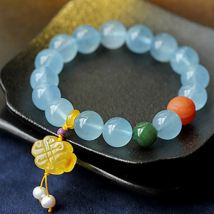 Pulsera de la paz con dije anudado chino, ámbar, aguamarina natural