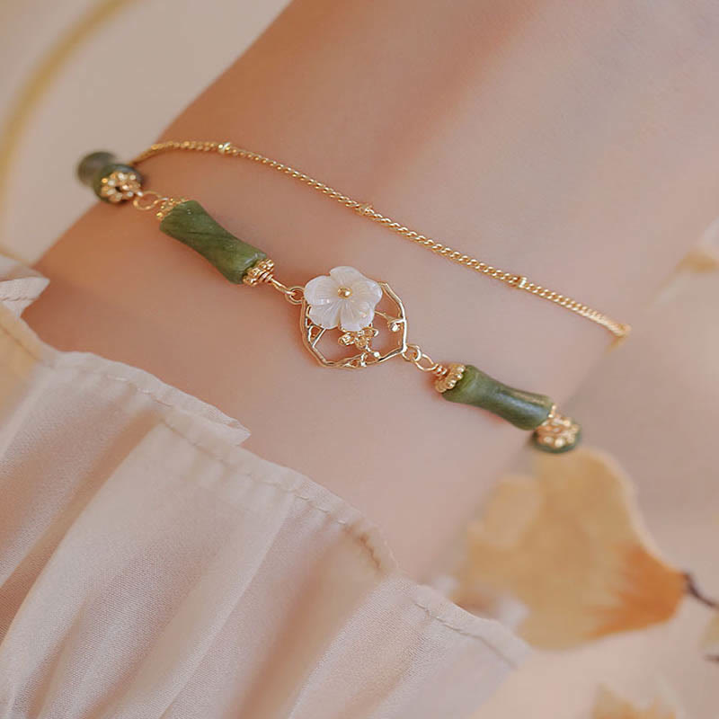 Pulsera de doble capa de cobre chapado en oro de 14 quilates con Buddha Stones , peridoto, flor de bambú y riqueza