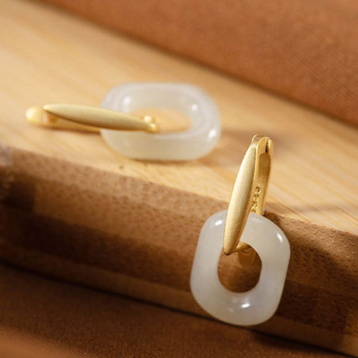 Pendientes de bendición de la felicidad de jade blanco redondo de plata de ley 925 con Buddha Stones