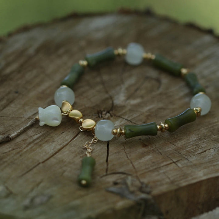 Pulsera de riqueza con Buddha Stones, bambú verde, jade, lirio de los valles