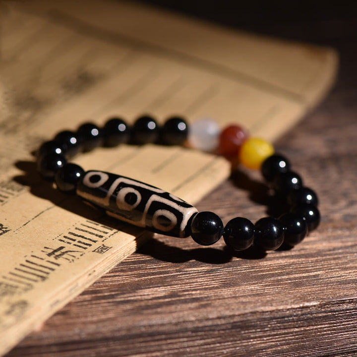 Pulsera de poder de riqueza con cuentas Dzi de nueve ojos naturales tibetanas de Buddha Stones
