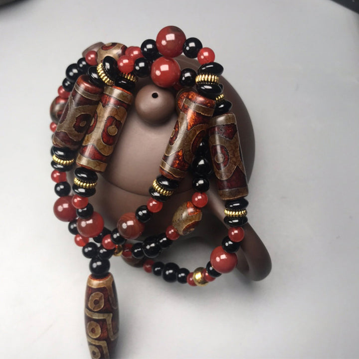 Collar de salud y riqueza con Buddha Stones Dzi de nueve ojos, ágata roja