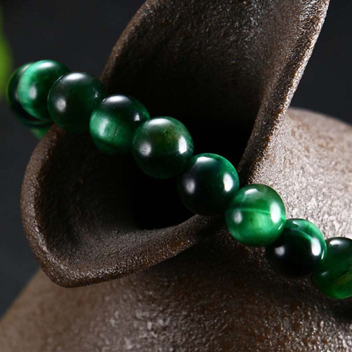 Pulsera de fuerza de ojo de tigre verde natural con Buddha Stones