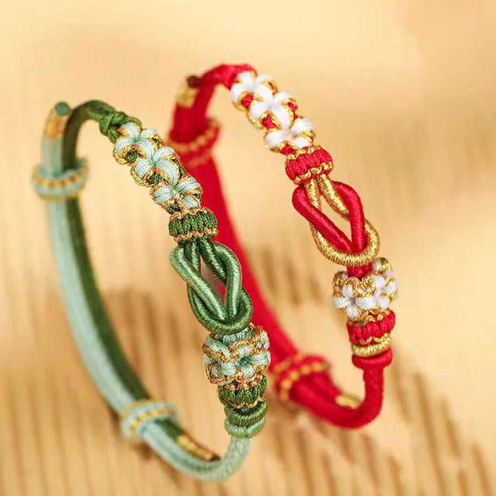 Pulsera de protección de la suerte con nudo de paz de ocho hilos con nudo de flor de melocotón hecho a mano con Buddha Stones