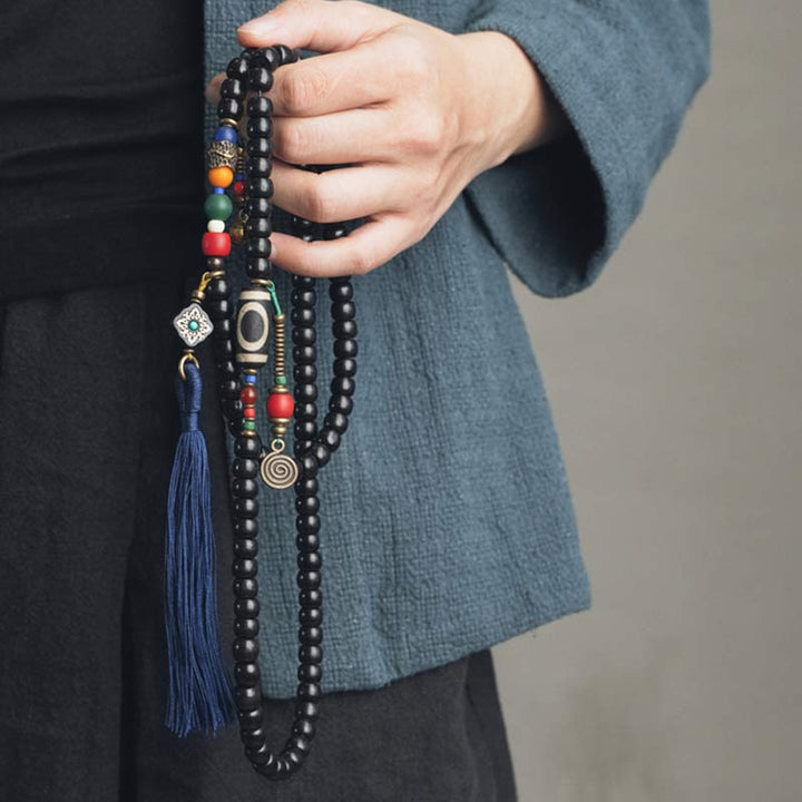 Buddha Stones 108 cuentas Mala madera de ébano cuentas Dzi cobre equilibrio borla pulsera