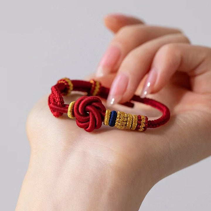 Pulsera de cuerda de la suerte con dije de flor de melocotón, nudo de amor verdadero hecho a mano con Buddha Stones