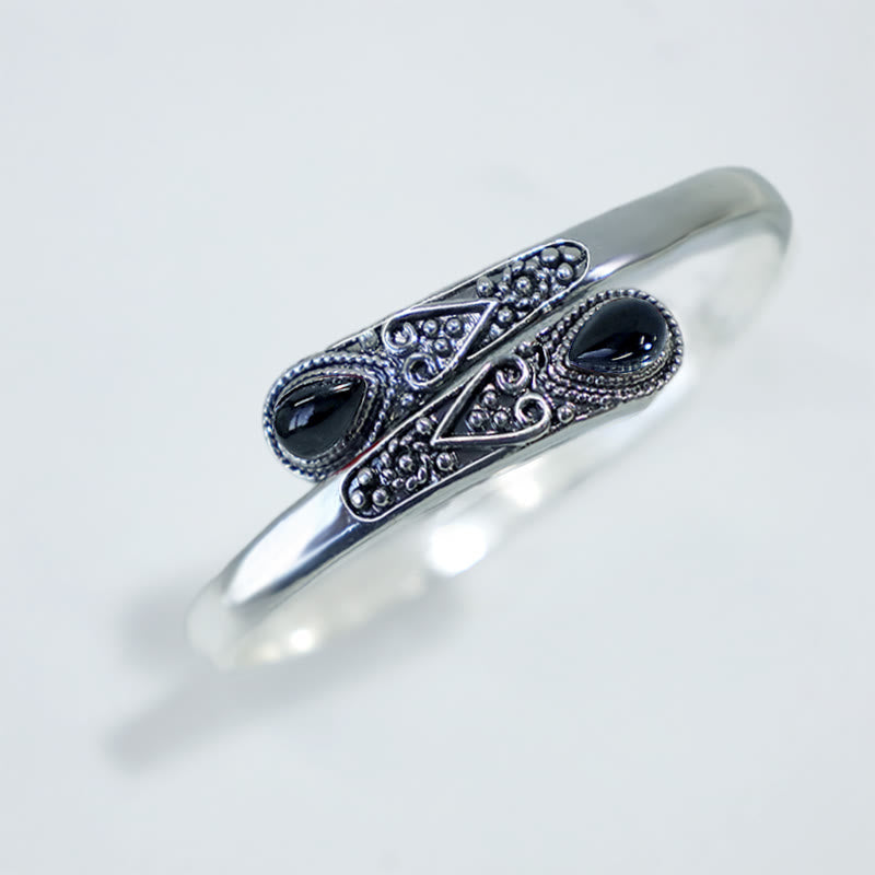 Brazalete de pulsera curativo con patrón de gota de agua de circonita con Buddha Stones