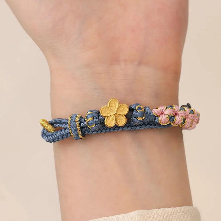 Pulsera de hilo de riqueza con diseño de flor de durazno