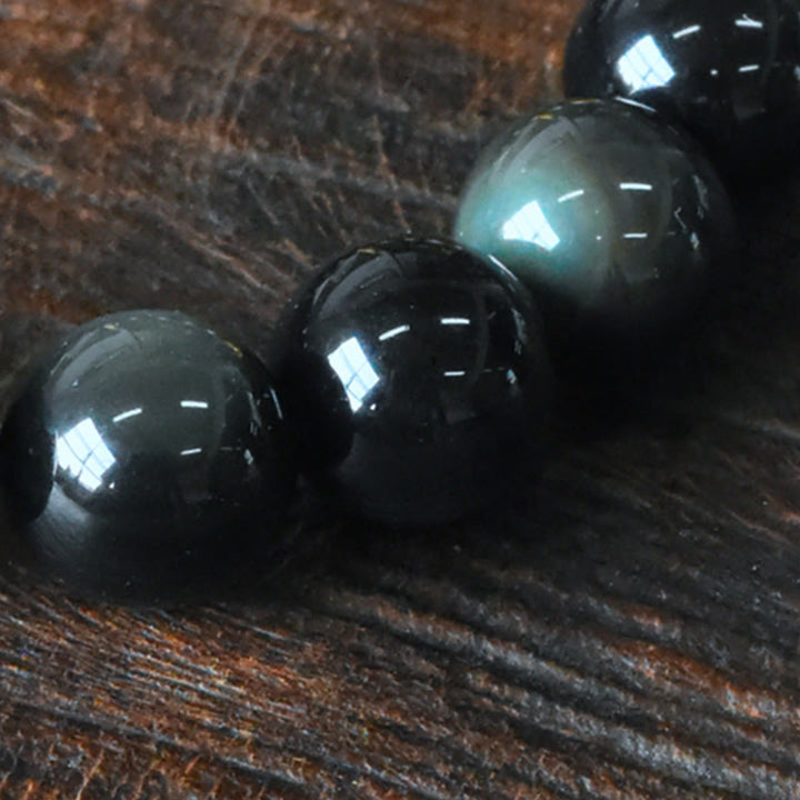 Pulsera de transformación positiva con cuentas de cobre y obsidiana arcoíris de Buddha Stones