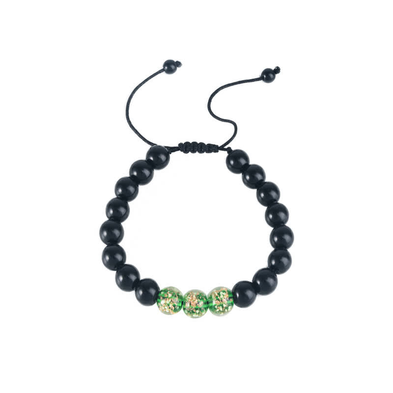 Pulsera de fuerza con piedra luminosa luminosa de obsidiana negra de Buddha Stones