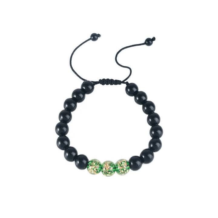 Pulsera de fuerza con piedra luminosa luminosa de obsidiana negra de Buddha Stones