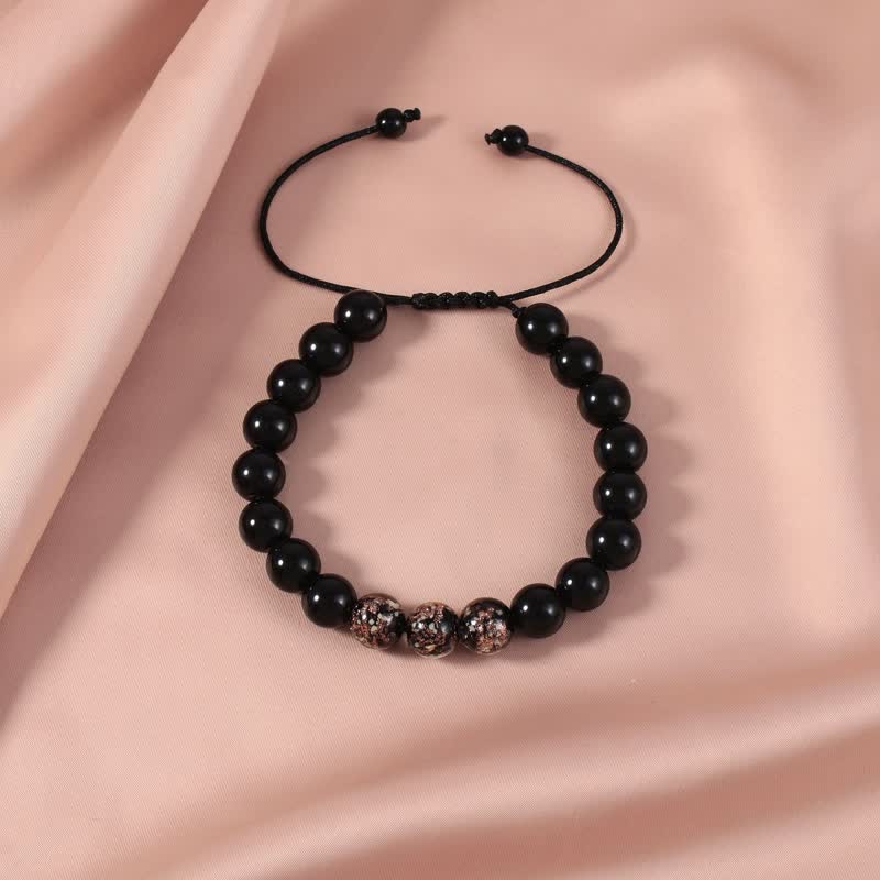 Pulsera de fuerza con piedra luminosa luminosa de obsidiana negra de Buddha Stones