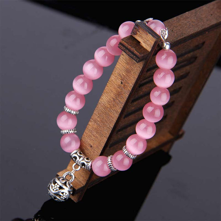 Pulsera de la suerte con ojo de gato tibetano y Buddha Stones