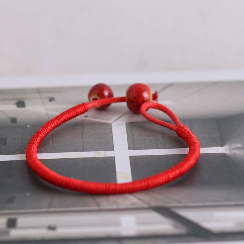 Pulsera de cerámica con hilo rojo de la suerte FengShui de Buddha Stones