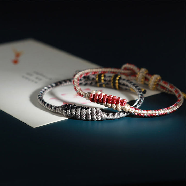 Pulsera de protección trenzada con rueda de oración, nudo de la paz, hecho a mano, con Buddha Stones tibetanas