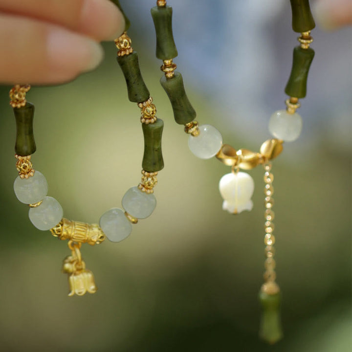 Pulsera de riqueza con Buddha Stones, bambú verde, jade, lirio de los valles