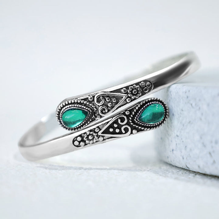 Brazalete de pulsera curativo con patrón de gota de agua de circonita con Buddha Stones