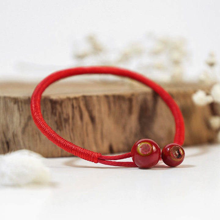 Pulsera de cerámica con hilo rojo de la suerte FengShui de Buddha Stones