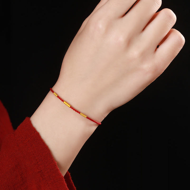 Pulsera de protección trenzada con nudos de deseos de cuatro hilos hecha a mano con cuentas de oro 999 de Buddha Stones