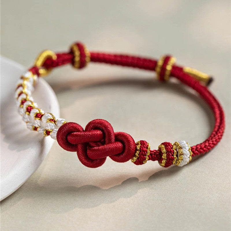 Pulsera de cuerda de la suerte con dije de flor de melocotón, nudo de amor verdadero hecho a mano con Buddha Stones
