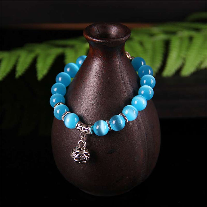 Pulsera de la suerte con ojo de gato tibetano y Buddha Stones