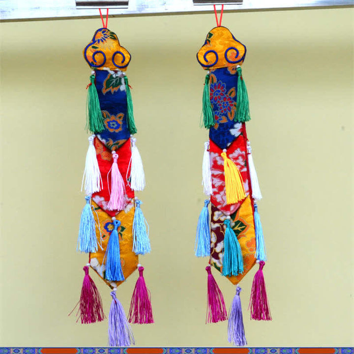 Flor de loto Ocho símbolos auspiciosos Meditación Iluminación Borlas coloridas Arte de pared