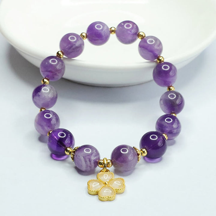 Pulsera con dije de trébol de cuatro hojas y paz interior de cristal de amatista natural con piedras de Buddha Stones