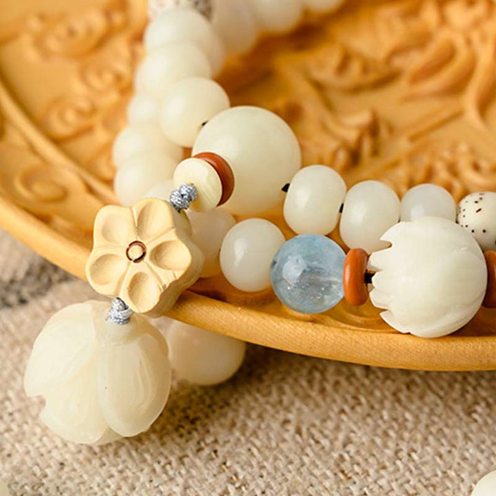Pulsera de bendición de loto Bodhi de jade blanco tibetano con Buddha Stones