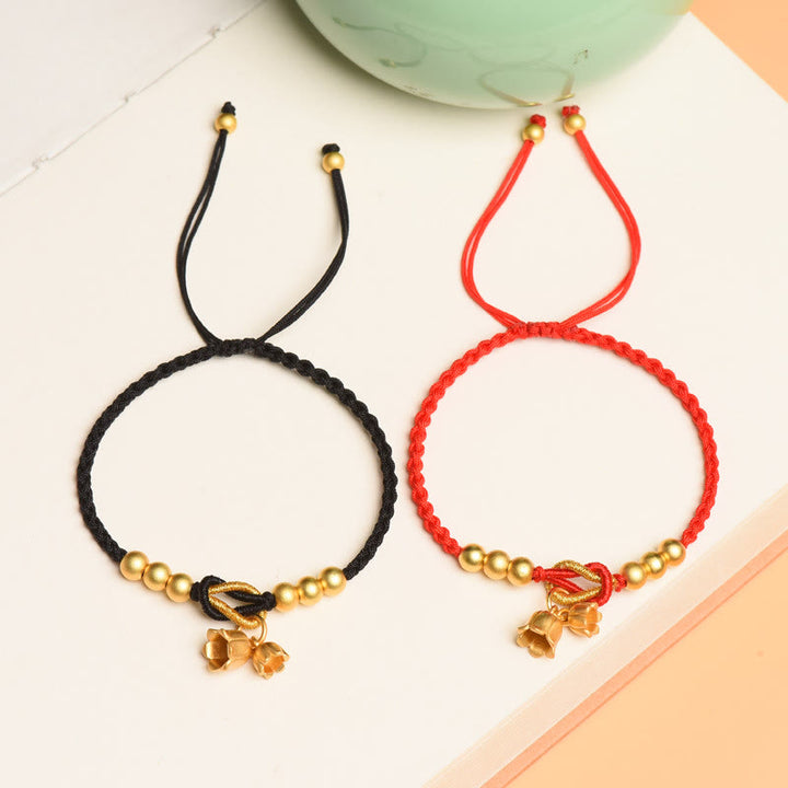 Pulsera trenzada de protección de la suerte con diseño de amuleto de flor de lirio de los valles hecha a mano con Buddha Stones