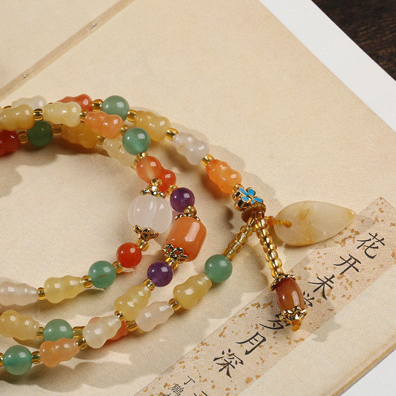 Pulsera de riqueza de calabaza de jade de seda dorada con Buddha Stones