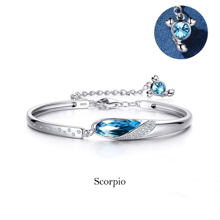 Pulsera con dijes de las 12 constelaciones del zodíaco de cobre bañado en plata 925 con Buddha Stones