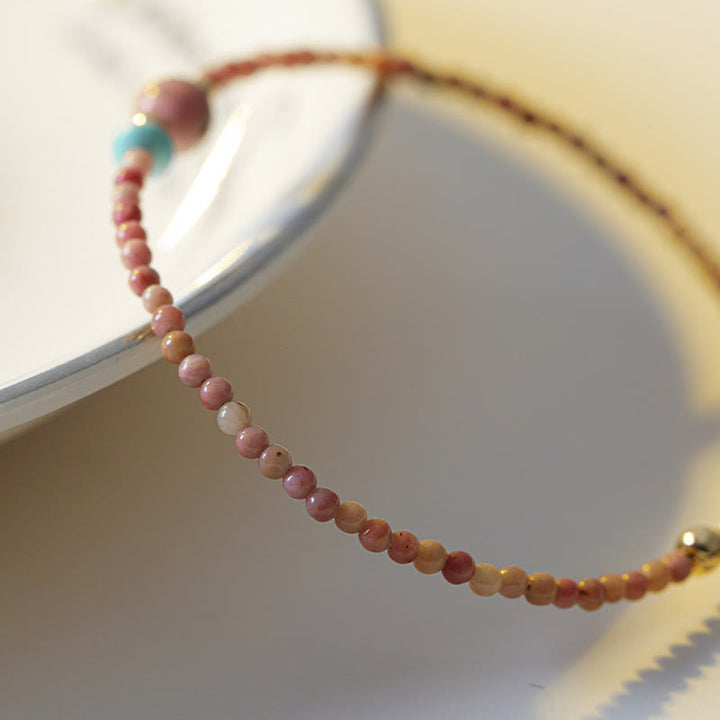Pulsera de cadena de energía amorosa de rodonita natural chapada en oro de 14 quilates con Buddha Stones