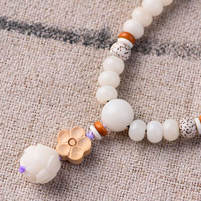 Pulsera de bendición de loto Bodhi de jade blanco tibetano con Buddha Stones