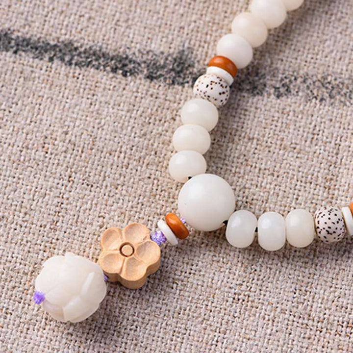 Pulsera de bendición de loto Bodhi de jade blanco tibetano con Buddha Stones