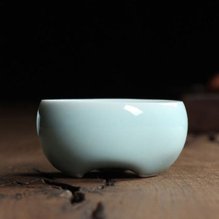 Taza de té de cerámica con forma de pez koi de colores y Buddha Stones