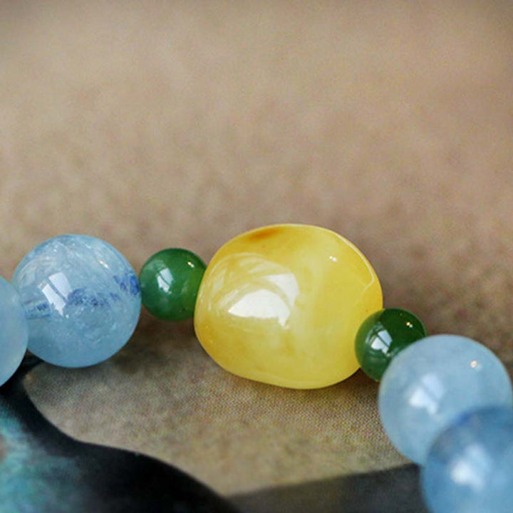 Pulsera curativa de serenidad con cuentas de ámbar y aguamarina natural